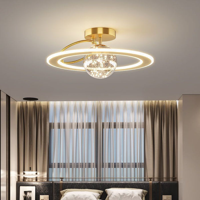 Aurora Starlit LED Ceiling Light — gold halo LED ceiling light with crystal accents glowing warmly in a bedroom