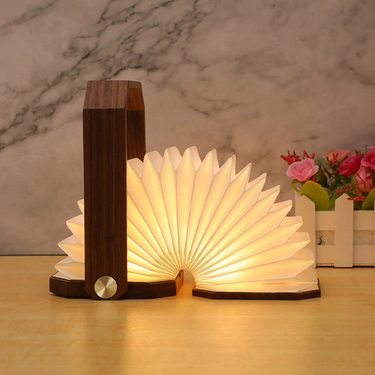 Mano Sculptural Hand Lamp — carved wooden hand table lamp cradling a warm light