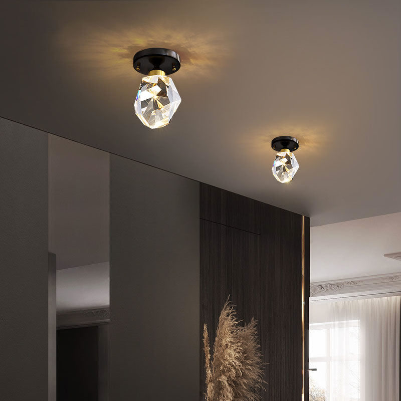 Celeste Crystal Flush Mount Light — brass flush mount ceiling light with faceted crystal globe in a hallway