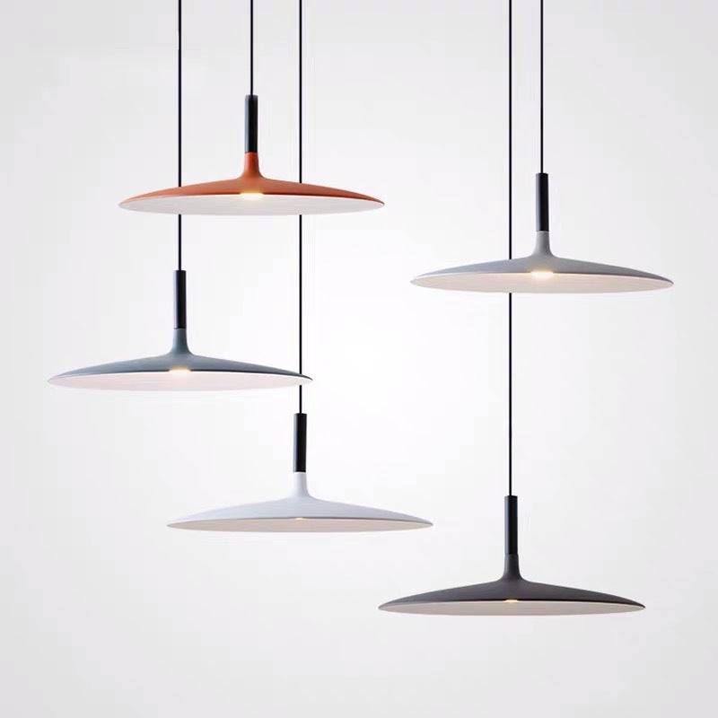 NovaSphere LED Pendant Light — slim disc LED pendant lights hanging in a modern kitchen