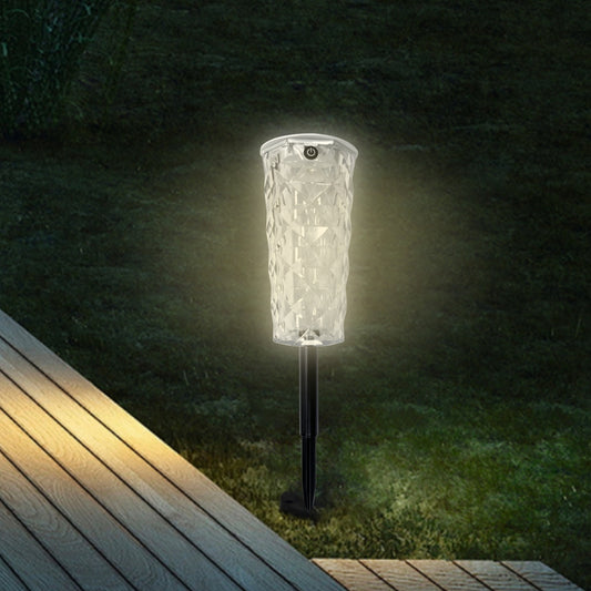 Rosa Solar Garden Lamp — colour-changing solar garden lamp glowing in a flower bed