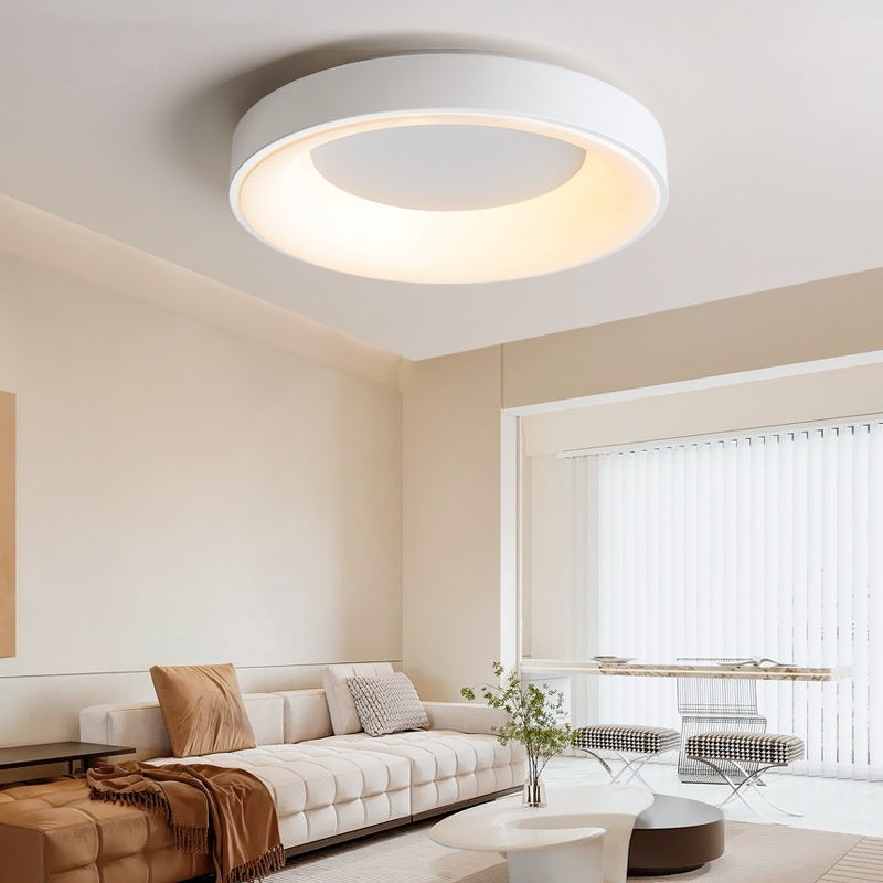 Lune Circular LED Ceiling Light — large circular LED ceiling light glowing softly in a neutral living room