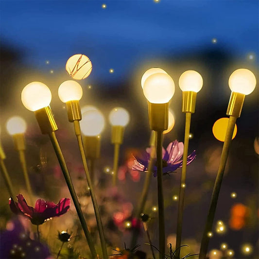 Lucciola Firefly Solar Light — firefly solar lights flickering through a garden border